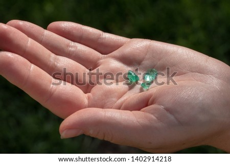 Natural Emeralds on The Hand Royalty-Free Stock Photo #1402914218