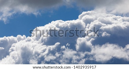 Details of a cumulus cloud. With blue sky.