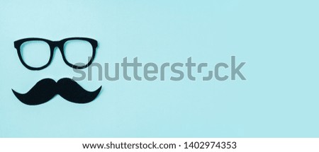 event design concept - top view of fathers day layout with silhouette of eye glasses and beard, copy space for mock up