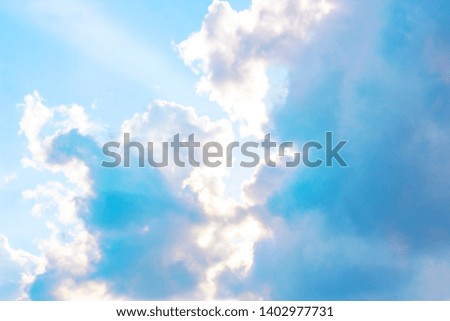 Beautiful gloomy blue sky with fluffy clouds in summer morning peace day as a background. Gray, white and turquoise color blured skyline photography