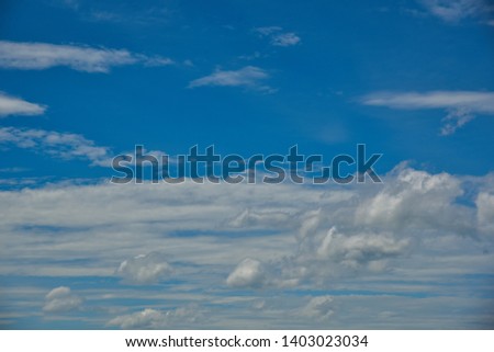 blue sky background with tiny clouds. 