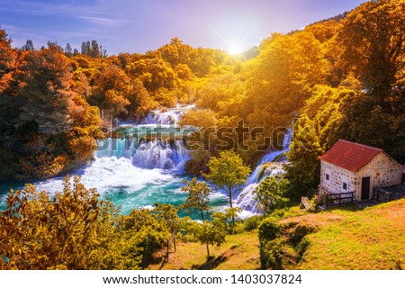 Krka national park with autumn colors of trees, famous travel destination in Dalmatia of Croatia. Krka waterfalls in the Krka National Park in autumn, Croatia.