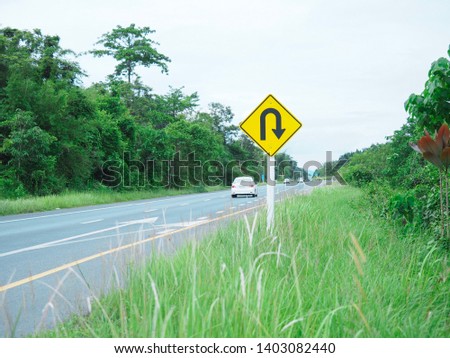 Traffic signs are located on the roadside for motorists to see.