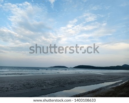 The background of the beach behind the mountains and the sky