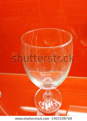 Liquid food container or drinking water and red background