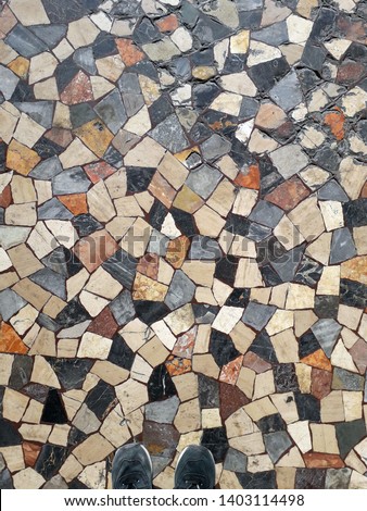 mosaic in the old church with sneakers