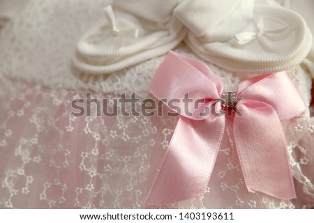 A newborn baby girl background. Close-up of baby shoes 
