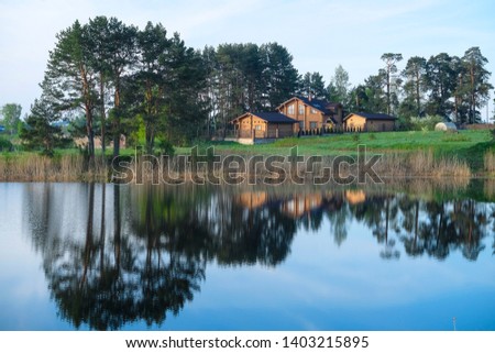 Landscape with the image of village Svetlitsa on lake Seliger in Russia