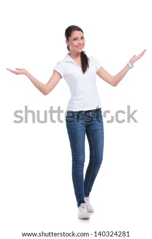full length picture of a casual young woman welcoming you with her arms opened and a smile. isolated on white background