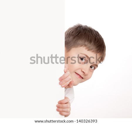 Boy look out through poster, looks directly