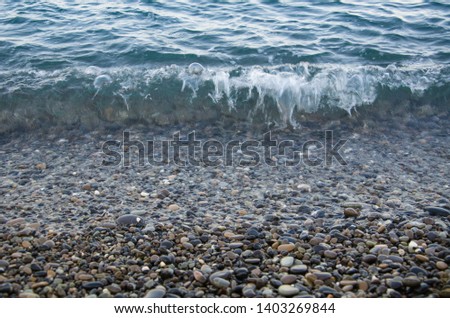 Seascape, view of stone beach and sea wave