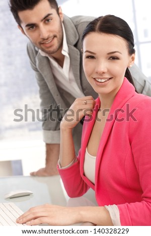 Portrait of attractive young office workers in the office.