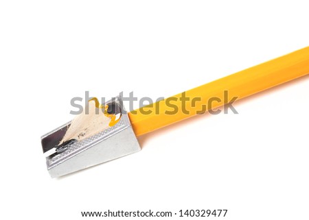 One orange pencil and pencil sharpener isolated on white background