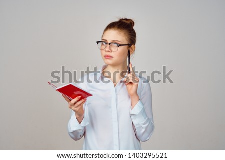  teacher in glasses with a notepad education                             