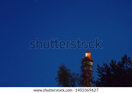 A lightohuse at night. Marine background