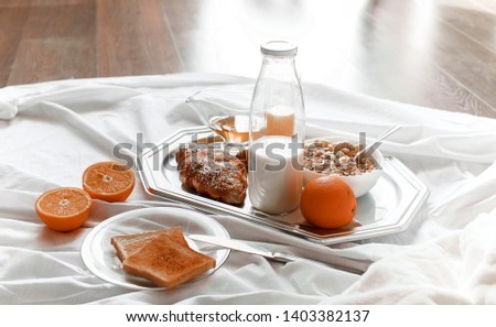 Breakfast served with coffee, orange juice, croissants, cereals and fruits. Balanced diet. 