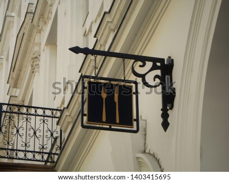 Restaurant "knife and fork" sign board in the city centre of Budapest, Hungary