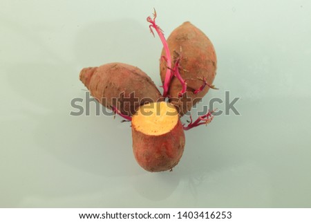 Background picture of three sweet potatoes