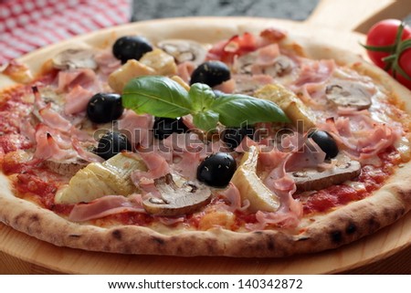 pizza with ham olives and tomato