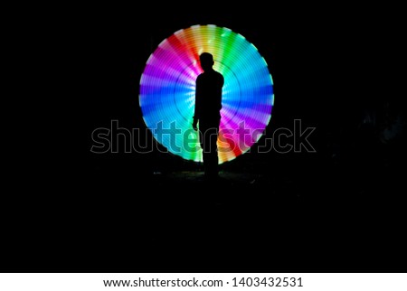 single man silhouettes on a rainbow circle pattern isolated on dark background 