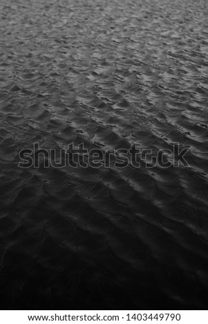 black and white landscape photo of water. The pattern of water. Expanse of the sea, light waves, beautiful pattern