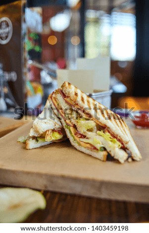 Sandwich set closeup photography, sandwich with vegetables, sausages and melted cheese commercial image