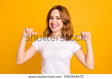 Close up photo amazing beautiful she her lady thumbs indicate direct chest self-confident toothy I am best choice choose pick select me advice wear casual white t-shirt isolated yellow background Royalty-Free Stock Photo #1403464670