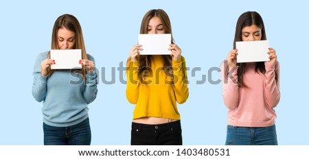 group of people with colorful clothes holding a placard for insert a concept on colorful background