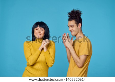    joyful young couple on a blue background                           