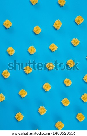 Raw pasta lie on pastel blue background. Minimal summer concept. Studio Shoot