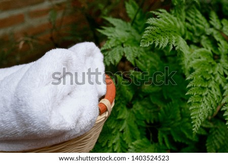 White Cotton Towels Use In Spa Bathroom. Towel Concept. Photo For Hotels and Massage Parlors. Purity and Softness.