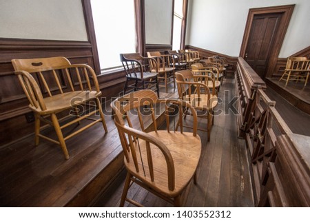 Juror Box. Jury box in courtroom at small rural county courthouse. Royalty-Free Stock Photo #1403552312