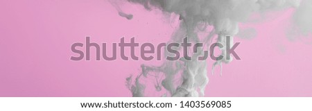 Close up view of white paint splash isolated on pink