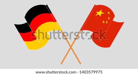 Crossed and waving flags of Germany and China