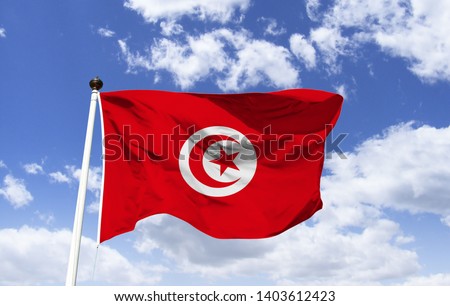 Mockup of Tunisia Flag fluttering under blue sky. Country in North Africa, bordered by the Mediterranean Sea and the Sahara Desert. In the capital Tunis, the Bardo museum. Al-Zaytuna Mosque.