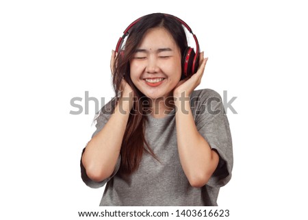 young woman wearing headset enjoying new audio tracks playing in smartphone.
