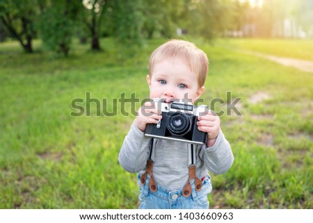 Baby boy photographer with camera