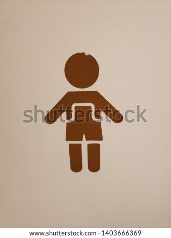 Boy's toilet sign on the wall