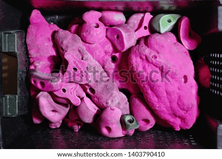 Pink climbing handholds in the box 