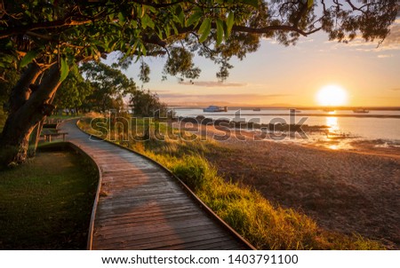 Sunset at the town of Seventeen Seventy Royalty-Free Stock Photo #1403791100