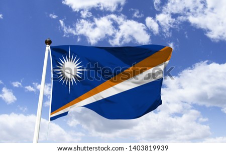 Marshall Islands flag mockup fluttering under blue sky. Country in Oceania. Marshall Islands is a Micronesian country and Wake Island belongs to the US. Capital: Majuro. Jaluit Atoll. Namorik