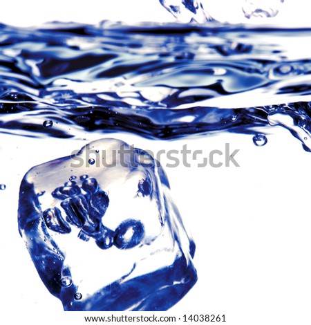  ice cube falling in clean water blue tone