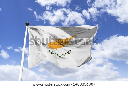 Flag of Cyprus, official symbol of the country, presents the design of the map of the island in copper-orange color, two branches of olive tree, symbol of peace between Turks and Greeks, blue sky.