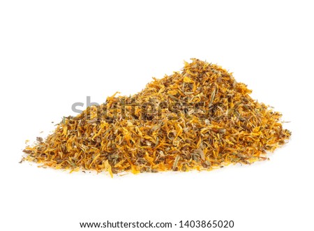 Pile of dried calendula petals on a white background