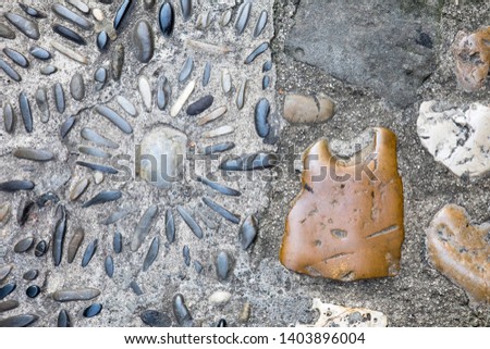 Modern abstract construction of cobblestone pavement in the hiking zone of the old city. Can be useful as background. 
