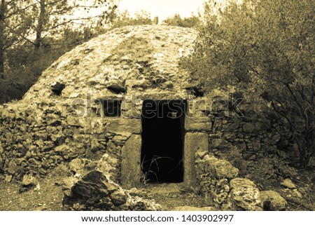 Ruins of stone spherical cistern (ancient Ottoman tank) for accumulation and storage of water. Old style photo