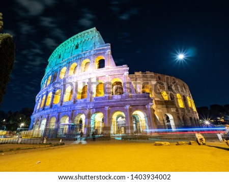 A night time picture of Oval amphitheatre in the centre of the city of Rome, Italy with light and full moon with no people