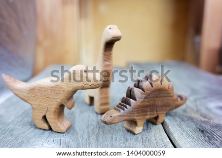 Wooden Carving Hand Made Organic Toys for Children. Ecological Smart Living and Education Concept. Environmental Friendly Stuff. Eco Home and Zero Waste. World of Play with Animals. Royalty-Free Stock Photo #1404000059