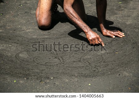 Sand drawing prediction culture of Ambrym Vanuatu South Pacific Island by magic man in the village, unrecognized person in image