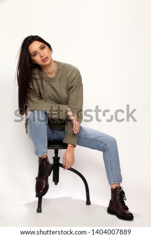 Beautiful, fashionable model posing on isolated background